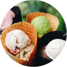 colorful scoops of ice cream in waffle cones